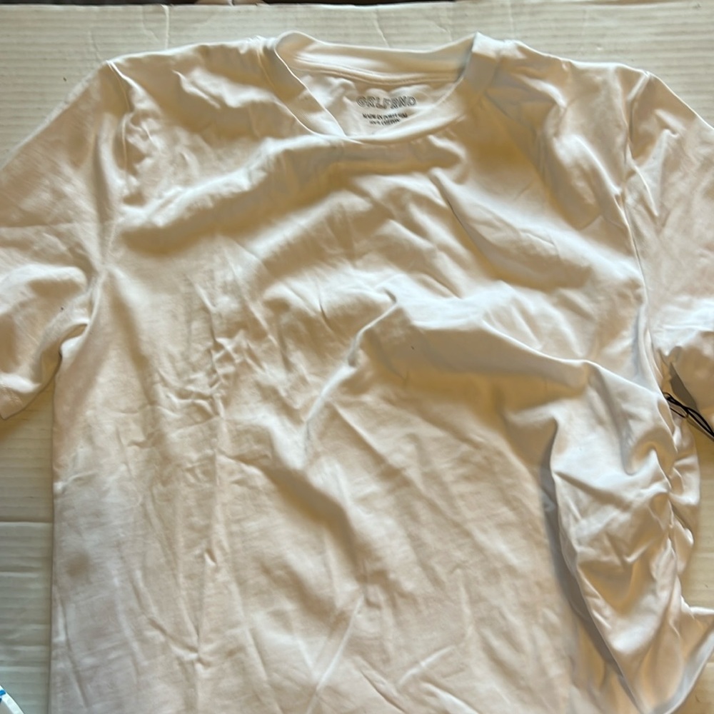 Grlfrnd white tee one side is crimped for style made of n Portugal